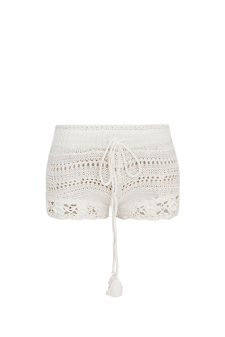 White crochet fabric shorts with a ribbed crochet waistband with a tassel drawcord at center front.