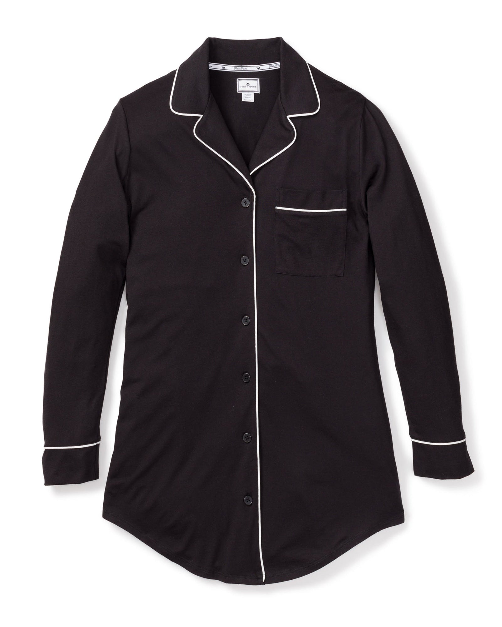 Petite Plumes Womens Pima Nightshirt in Black features luxurious Peruvian Pima cotton and elegant white piping on the collar, cuffs, and pocket. This black long-sleeve sleep shirt includes a button-down front and a single left chest pocket.