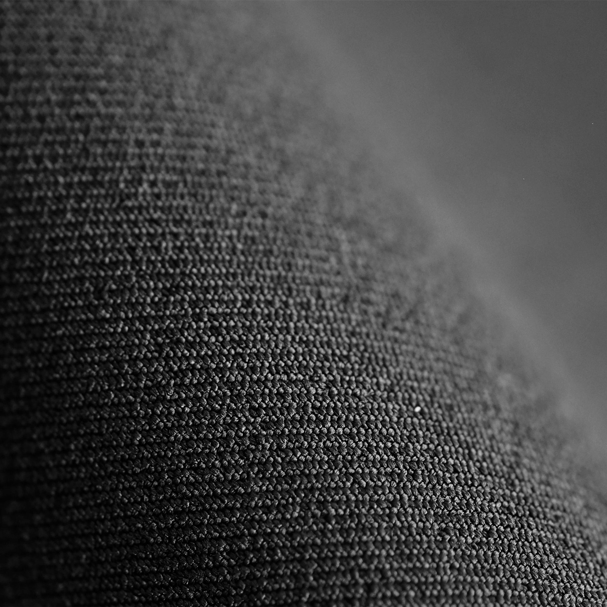 Close up image of powerstretch fabric in black | Exclude