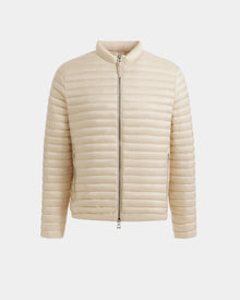 The REYMOND M - M125523 Vanilla by Rudsak is a beige men’s down jacket with horizontal quilting, front zipper, and short collar. Crafted from recycled nylon and RDS-certified down, it offers a sleek, minimalist look and long sleeves.