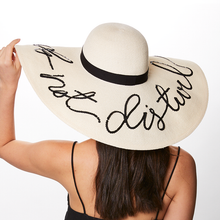 Eugenia Kim Sunny 'do not disturb' sunhat in ivory back view on model