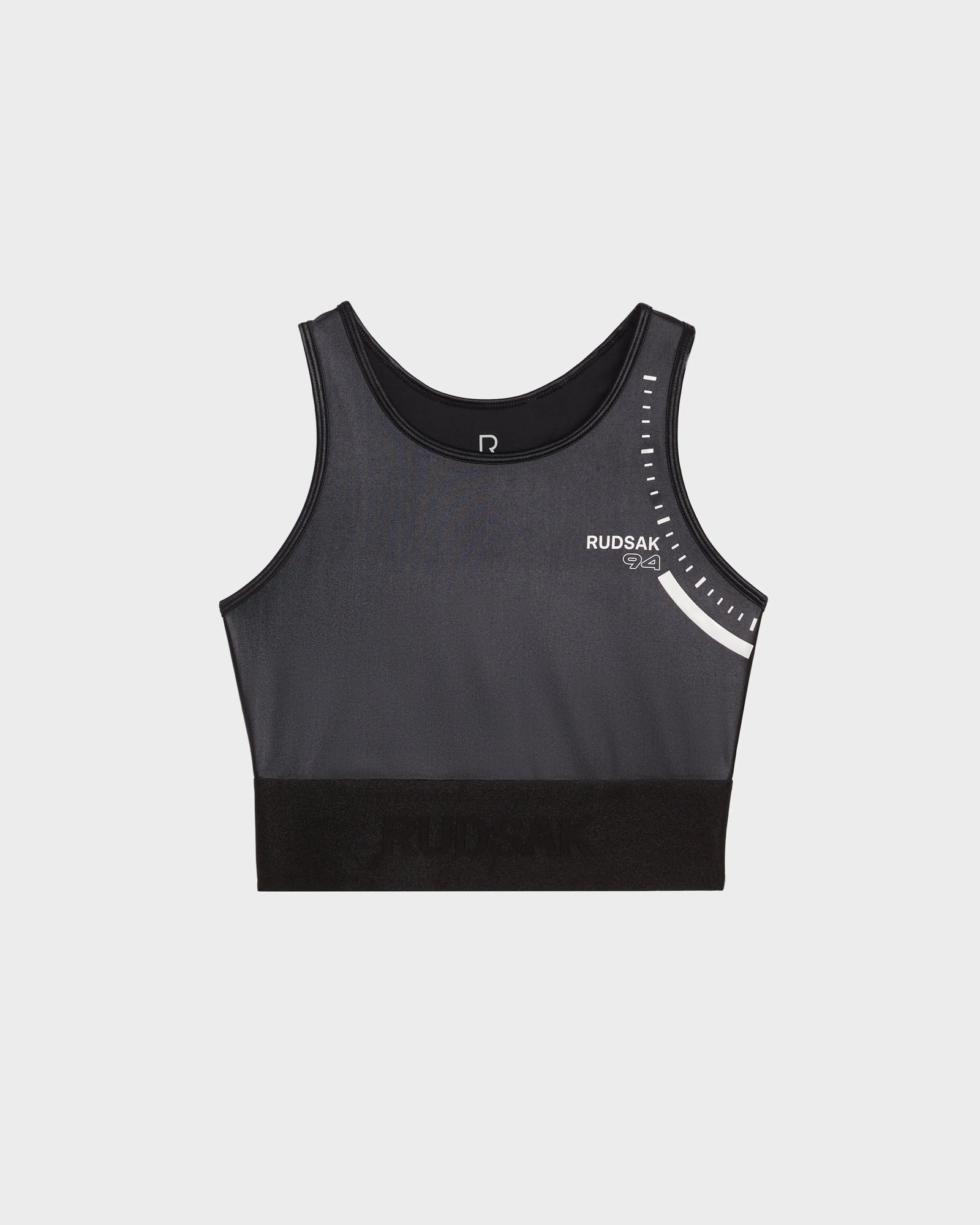 The TRACY - 8524016 Black by Rudsak is a womens high-performance black athletic crop top sports bra with white graphic details and branding on the upper left, shown against a plain white background.