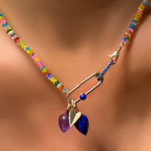 Garden party opal necklace with sapphire charm lock, and paperclip charm lock with lapis, with an amethyst and lapis drop charm along with a half pavé folded heart charm on the neck.