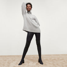 Front image of a woman standing wearing the Harrington Leather—Vegan Leather in Black