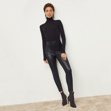 Front image of a woman standing wearing the Harrington Leather—Vegan Leather in Black | Lead