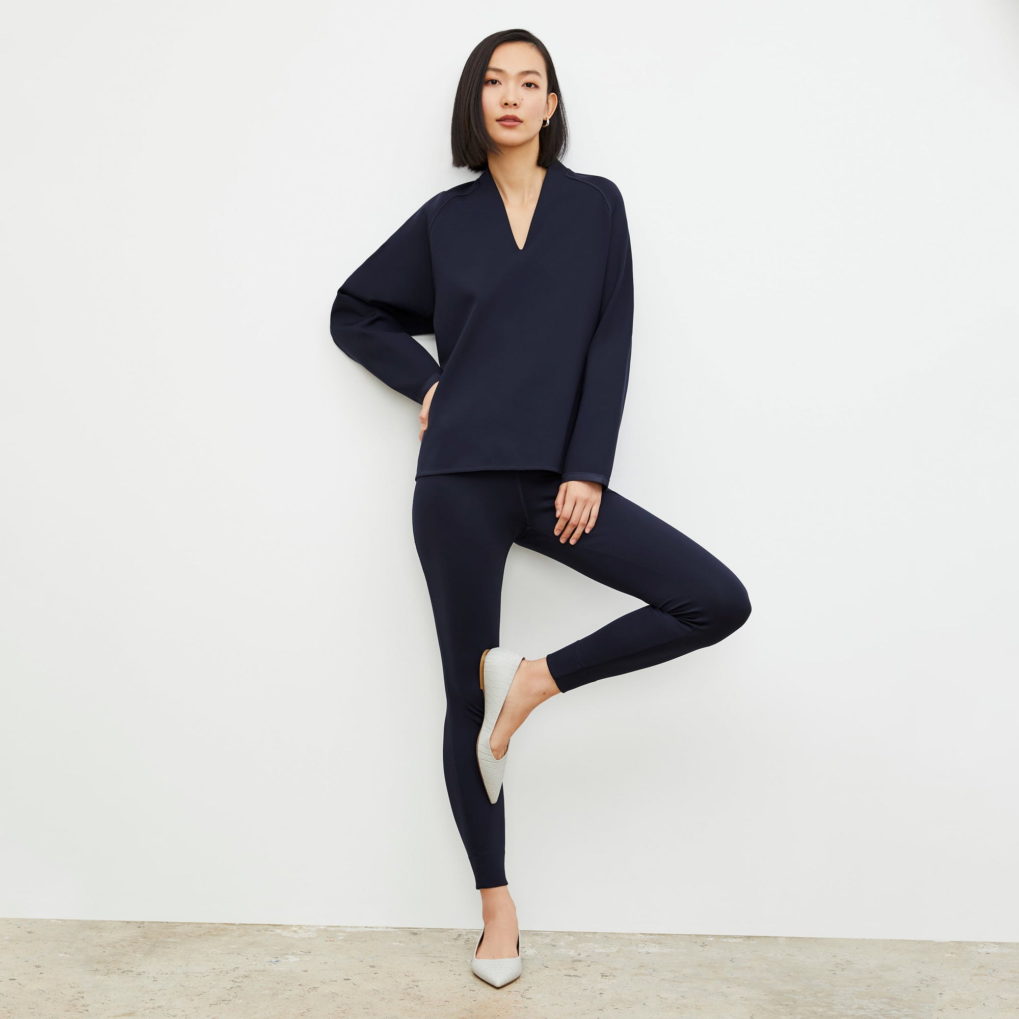 Front image of a woman wearing the Harrington Legging - Light Scuba in Space Blue
