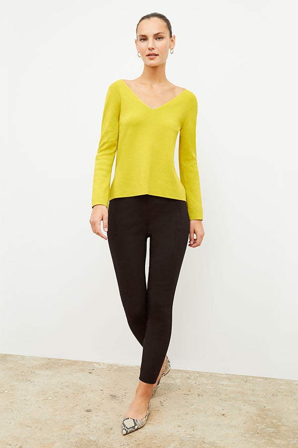 Front image of a woman wearing the kara top in chartreuse | Exclude
